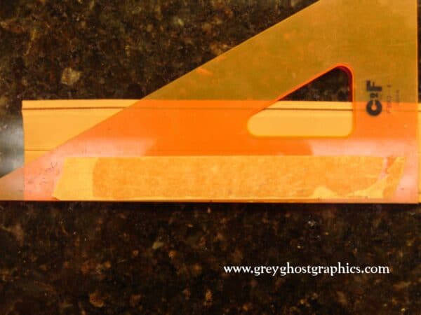 Drafting triangle is used to scribe a 30 degree line across the leather.